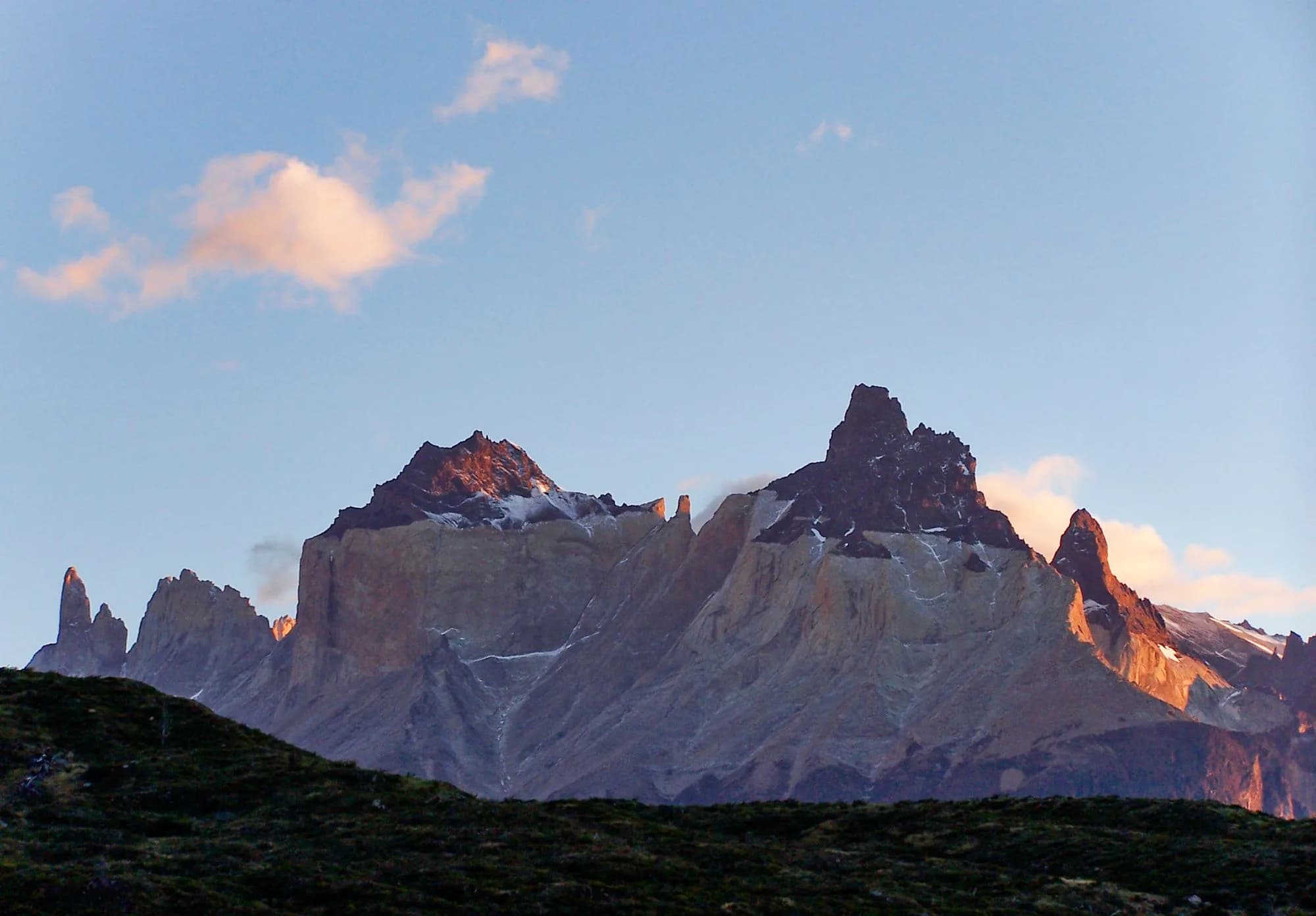 The peaks of Torres del Paine glowing at sunrise in Patagonia