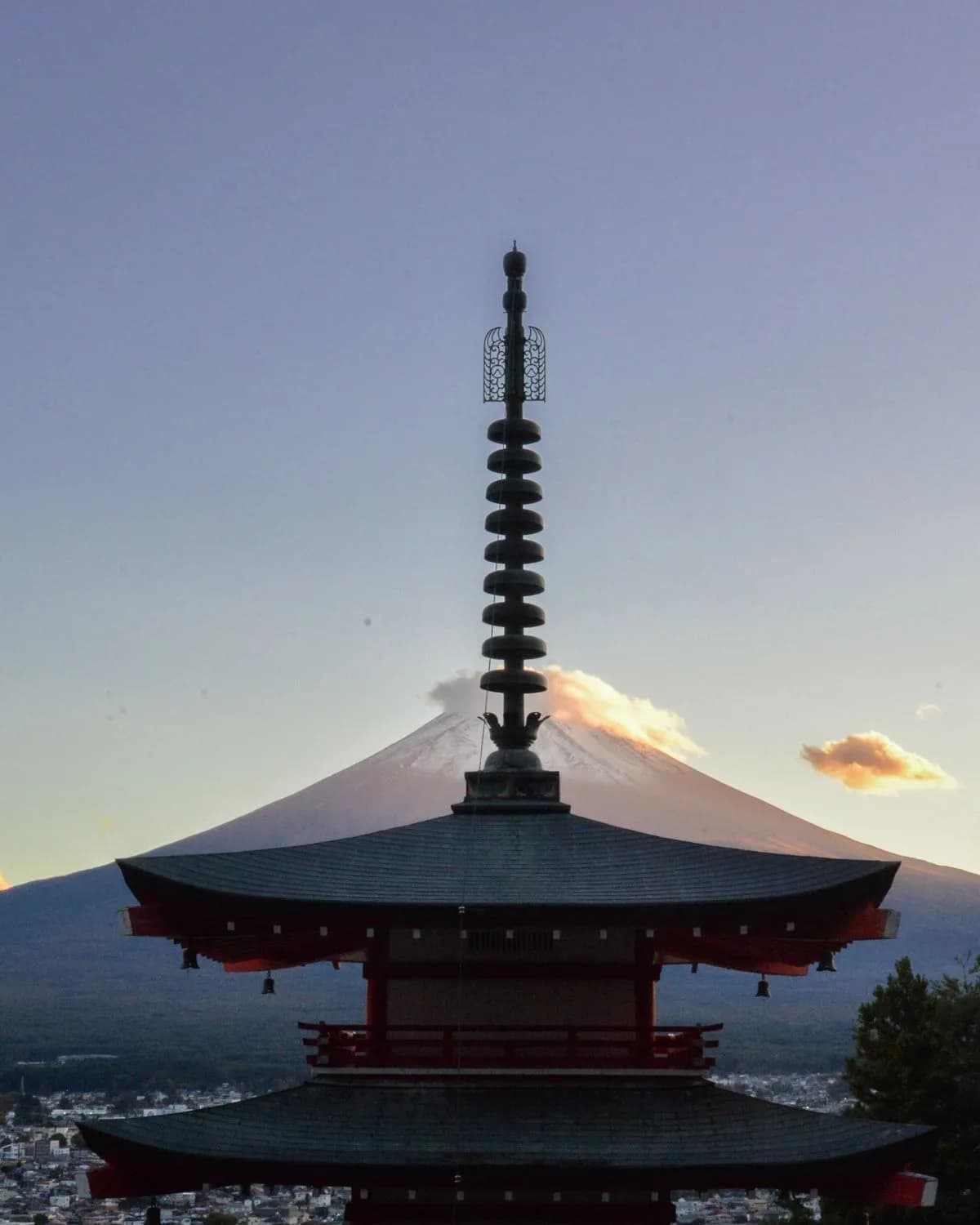 The Chureito Pagoda silhouetted against Mount Fuji at sunset